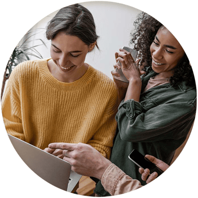 women-employees-looking-at-pc-screen