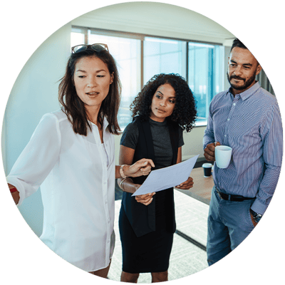 Three colleagues discussing something in an office